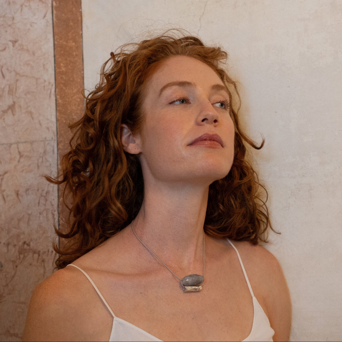Grape silver and blown glass necklace worn by a model, handmade by Aguamarga Studio and House of VV in Barcelona
