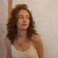 Grape silver and blown glass necklace worn by a model, handcrafted by Aguamarga Studio and House of VV in Barcelona