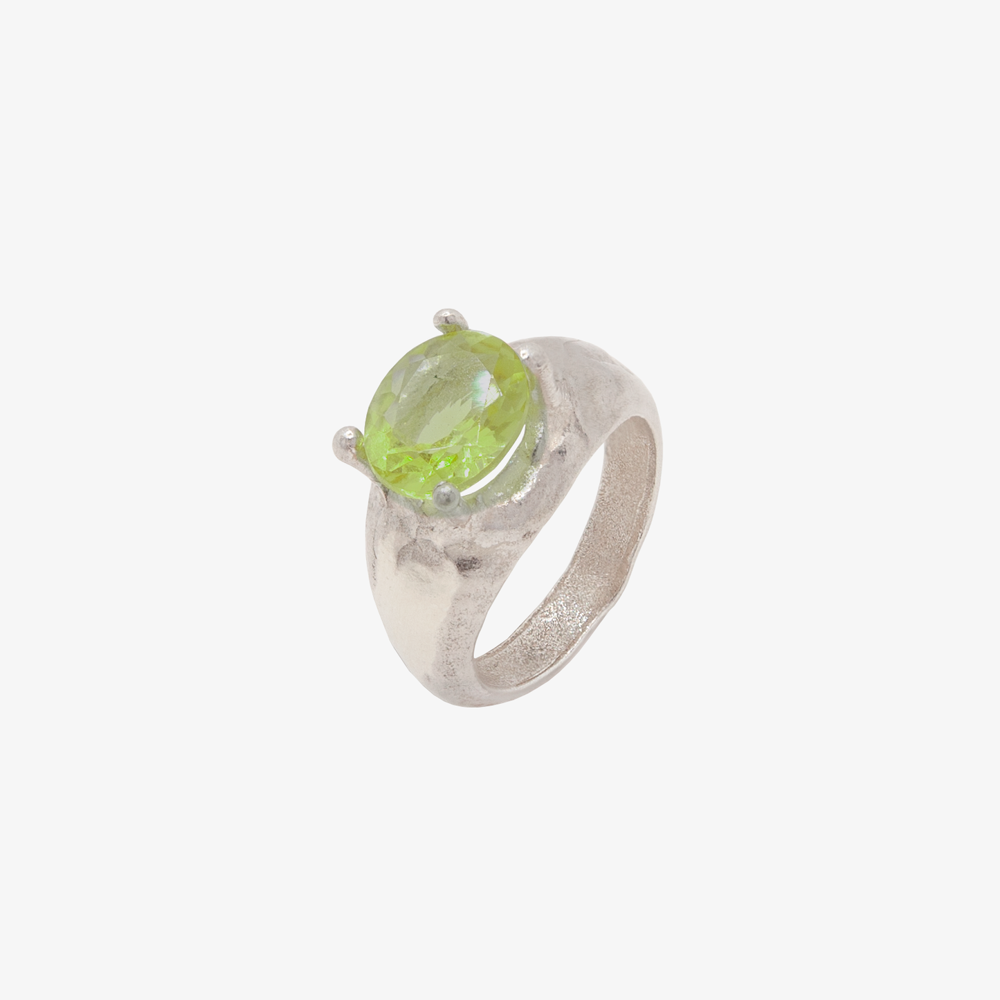 sculptural silver ring featuring oversized green peridot gemstone